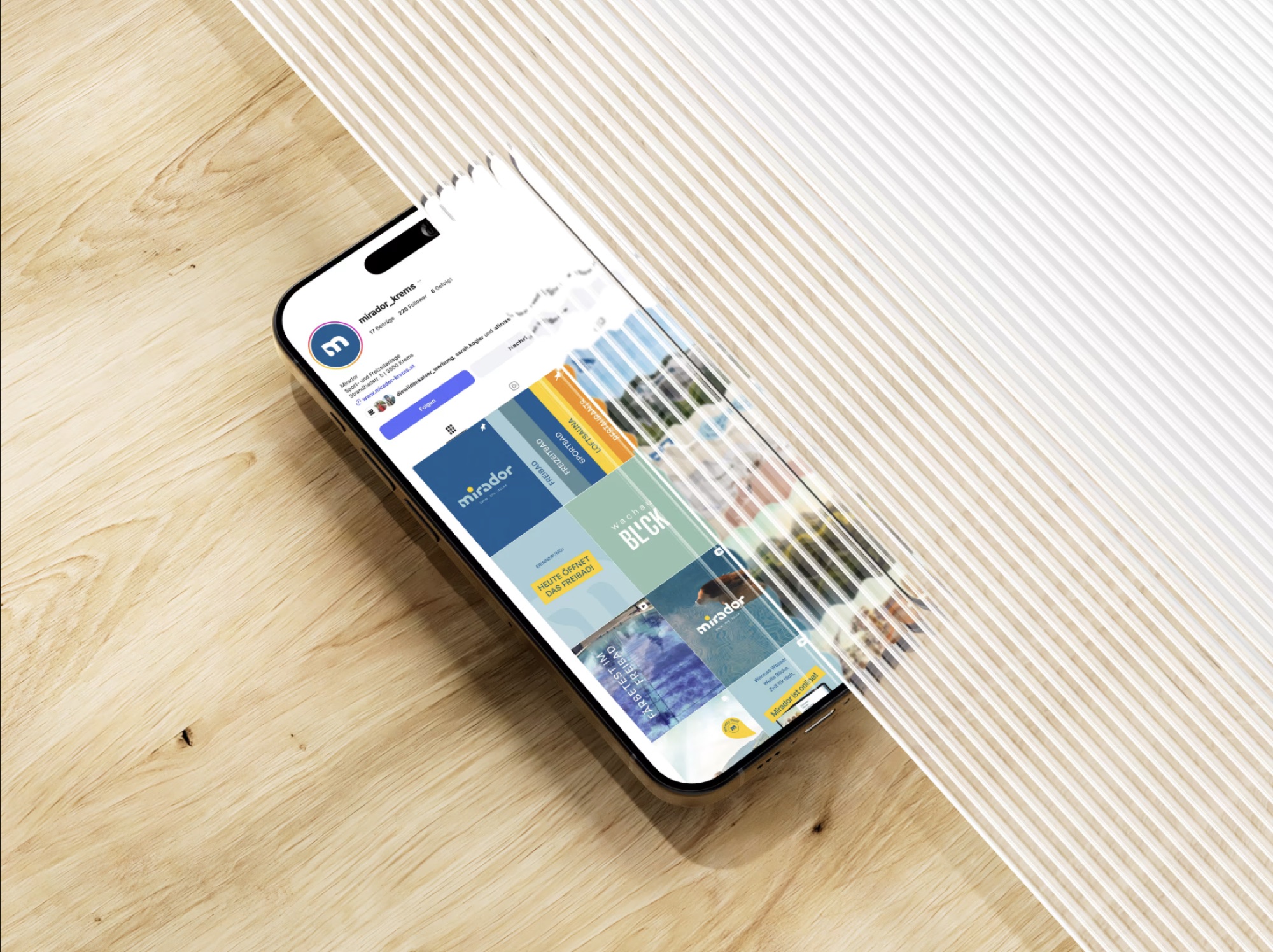 Instagram-Profil von Mirador auf einem Smartphone mit Posts zu Freibad und Events